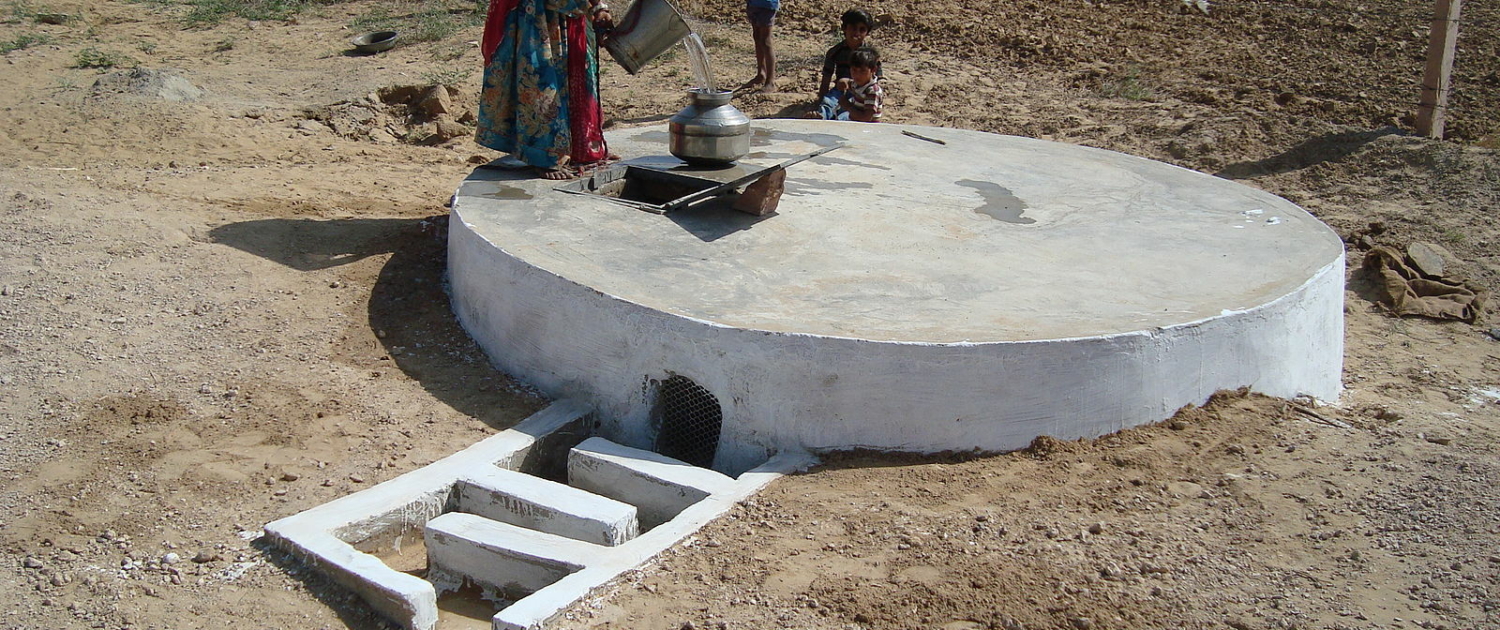 A villager collects water from a taanka in the That Desert