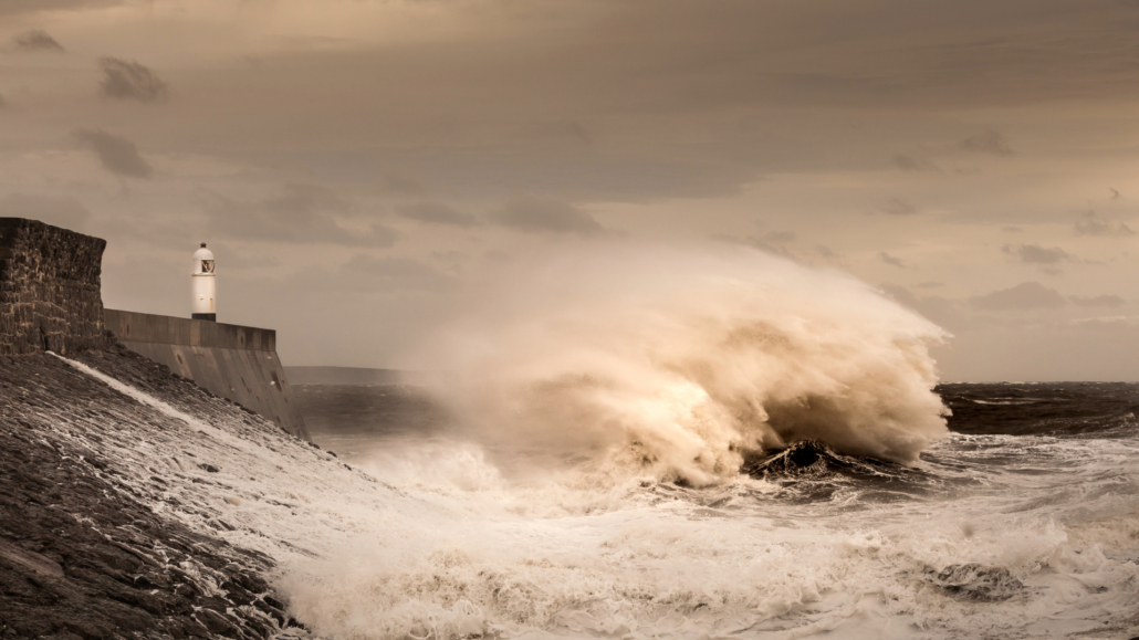 Crashing Waves Storm Desmond hits Porthcawl and crash into the lighthouse and pier in South Wales, UK.